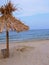 Exotic beach straw umbrella on a beautiful tropical beach