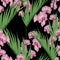 Exotic bright green palms leaves and pink orchid flowers branch, black background.