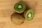 Exotic brown kiwifruit on light wood