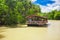 Exotic cruise boat with tourists on jungle river