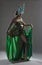 Exotic dancer in green costume with feathers
