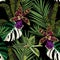 Exotic flowers seamless pattern. Tropical violet green orchid flowers and palm leaves in summer print.