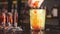 Exotic fruit cocktail in glass isolated on blurred restaurant background