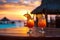 Exotic fruit tropical cocktails on beach resort at sunset