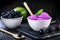 Exotic jabuticaba ice cream, purple color. Dessert served in biodegradable plastic bowl