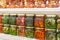 Exotic jam from spruce branches, mountain herbs and berries in glass jars. Selective focus