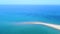 Exotic touristic destination, tropic sandbank beach and turquoise clear sea. Aerial view