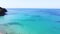 Exotic turquoise sea and sandy beach for vacation travel. Aerial drone view