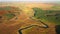 Exotic view from a drone flying over the sinuous river in sunny day. Filmed in 4k, aerial drone video