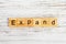 EXPAND word made with wooden blocks concept