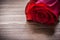 Expanded rosebud on wooden board holiday concept