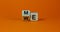 Expanded wood cube with me or we words on beautiful orange background, copy space.  Psychological concept