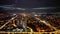 Expansive aerial shot of the bustling cityscape of Skopje at night in the Republic of Macedonia