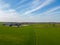 Expansive Aerial View of Farm Buildings Amidst Lush Farmland