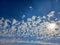 Expansive blue sky, dotted with fluffy white clouds, stretches out to the horizon