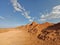 Expansive desert landscape featuring rock formations and jagged cliffs