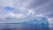 Expansive glacier drifting through a tranquil ocean