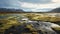 Expansive Landscapes: A River Running Through Rocks And Grass