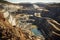 Expansive Open-Pit Mine with Machinery and Layered Excavation