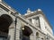 Expansive palace with majestic arched and grand columns. Royal Palace of Madrid, Spain.