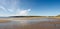 Expansive sandy beach and a big sky in southern Ireland