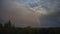 Expansive Sky with Clouds and Rainbow