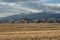 Expansive Valley Below Dunes and Mountains