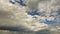 Expansive View Of A Blue Sky Filled With White Cumulus Clouds Casting Shadows On Each