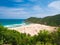 Expansive view of scenic tropical bay, Bai Mon gorgeous golden beach and sand dunes blue waving sea. The easternmost coast in