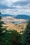 an expansive view of a valley below the clouds that are over a forest