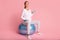 Expectant Lady Exercising With Dumbbells Sitting On Fitball, Studio Shot