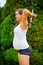 Expectant Mother Doing Overhead Triceps Extensions With Dumbbell