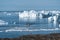 Expedition boat in the Disko bay nearby of Ilulissat, Greenland. Panoramic aerial vew towards icefjord with icebergs and