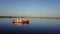 Expedition research vessel bright red color in Ocean on New Earth Vaigach.