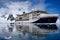 Expedition Ship, Cruiser, Cruise Liner, in Antarctica with Zodiacs in front. Hanseatic Nature from Hapag Lloyd Cruises.