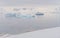 Expedition vessel in front of Antarctic iceberg landscape at Portal Point