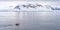 Expeditions - Zodiac with tourists cruises through Antarctic iceberg landscape at Portal Point