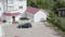 Expensive car at country cottage. Video. Top view of car arriving at large country cottage. Car with rich family came to