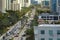 Expensive highrise hotels and condos on Atlantic ocean shore in Sunny Isles Beach city and busy street traffic. American