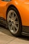 Expensive orange super car front tire