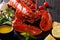 Expensive organic food: boiled lobster with lemon, garlic, fresh