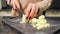 Experience housewife cuts vegetables cooking dish for lunch