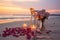 Experience pure romance by the sea candles, flowers, sunset, and love filled moments