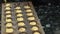 Experienced baker pours dough into forms in kitchen in pastry shop.