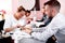 Experienced beauty salon worker handling her customer with a manicure treatment