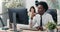 An experienced company employee dressed in a shirt and tie prepares documents on the computer, drafts an article or a