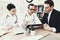 Experienced doctor advises businessman in medical office. Consultation with attending physician.