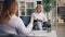 Experienced female psychologist talking to emotional obese woman in office