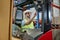 Experienced focused lift truck operator working in the warehouse