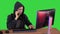 Experienced hacker answers someones call on a Green Screen, Chroma Key.